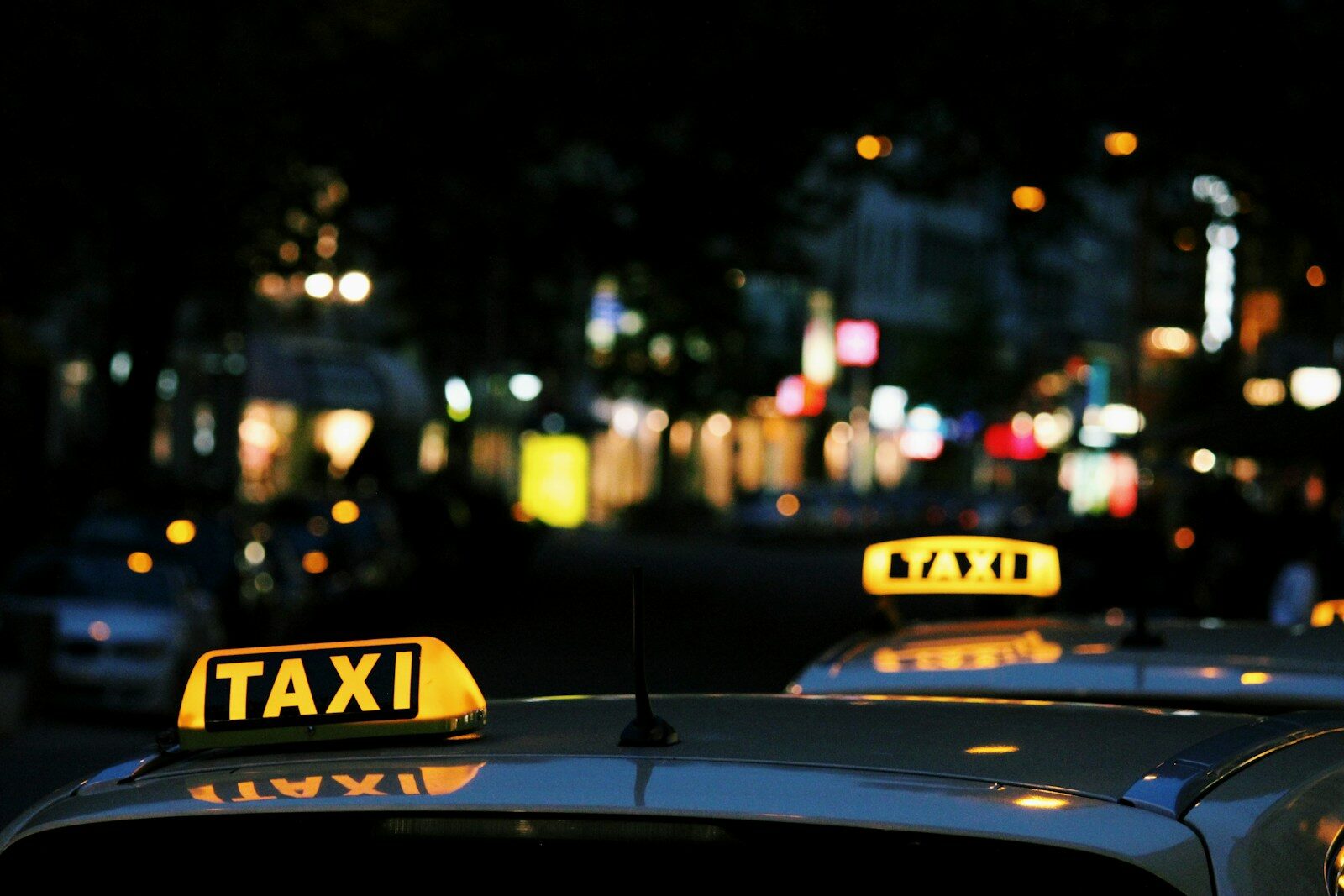 Photo by Lexi Anderson shallow focus photography of Taxi signage